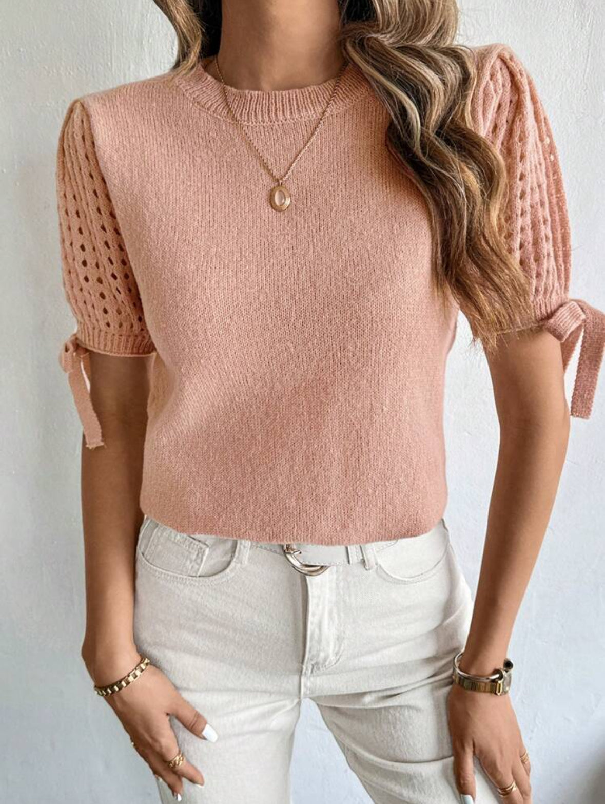 Pull tricoté à nœud