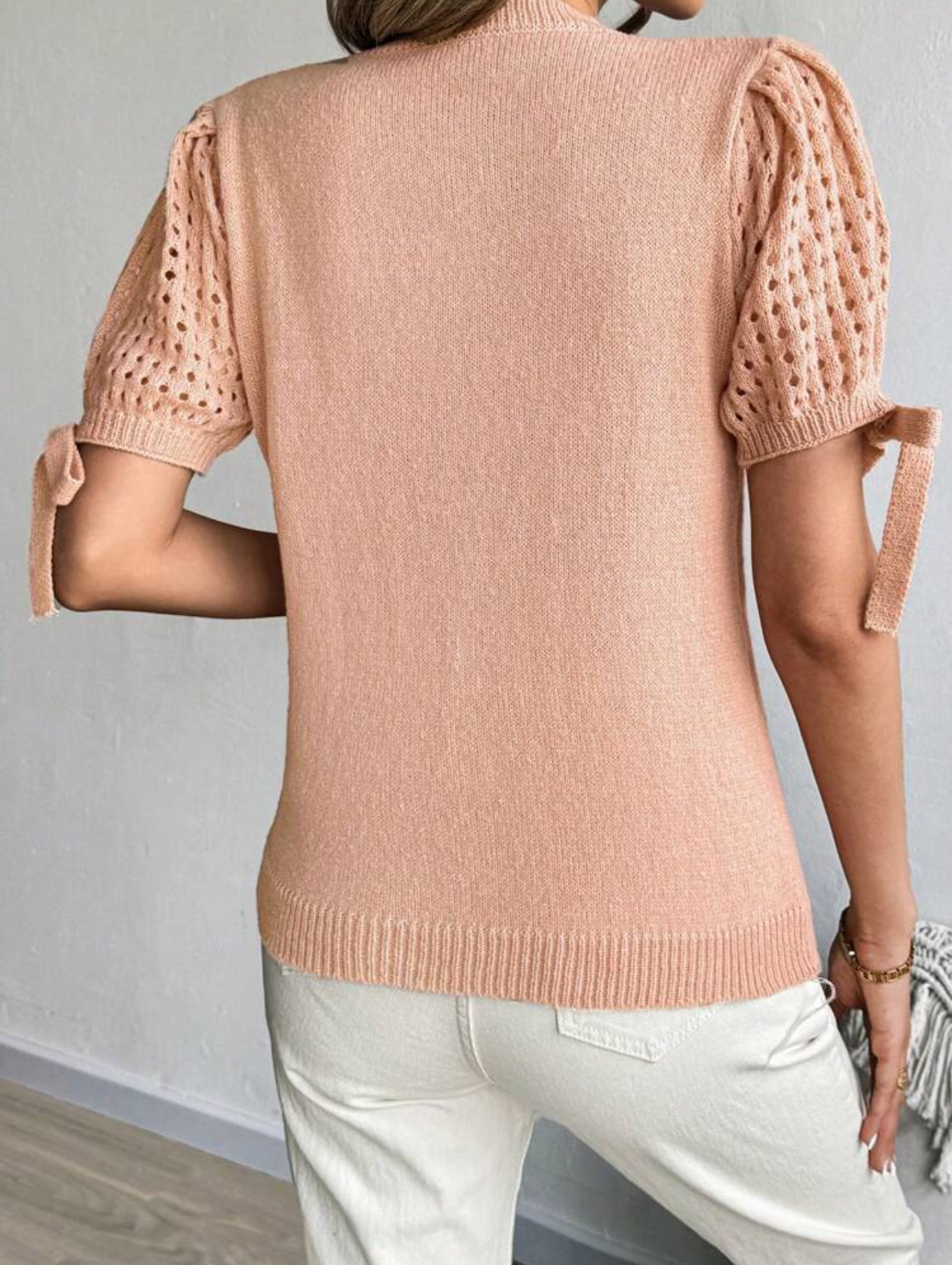 Pull tricoté à nœud